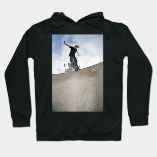 Skateboarder doing a tail slide Hoodie